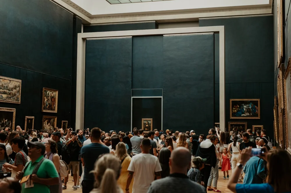 people visiting the Salle des Etats Louvre